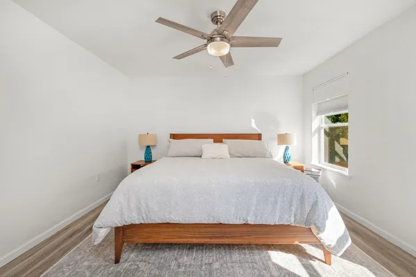a bedroom with a bed and window