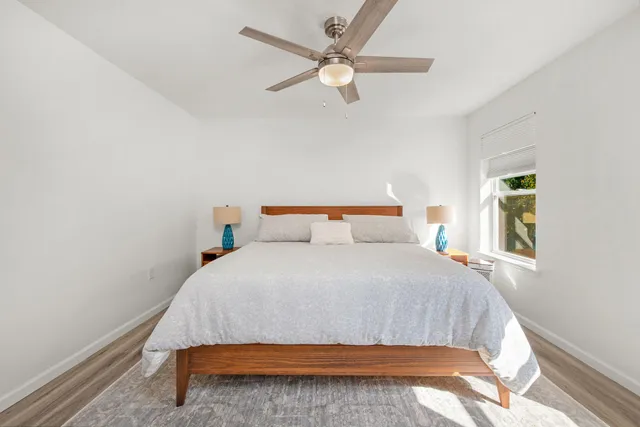 a bedroom with a bed and window