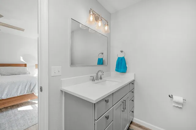 a bathroom with a sink and a mirror
