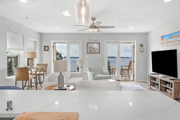 a large kitchen with a table and chairs in it