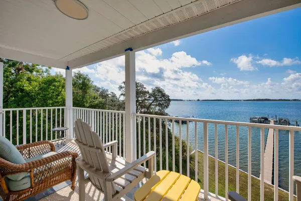 a view of a balcony with furniture