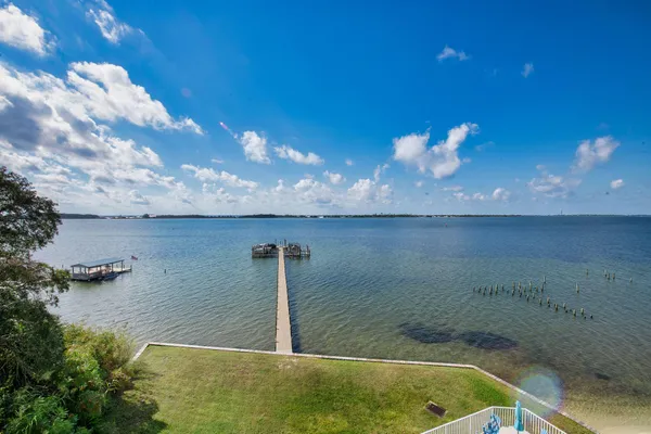 a view of a swimming pool with a lounge chairs