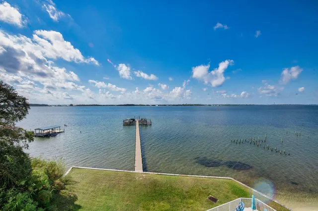 a view of a swimming pool with a lounge chairs
