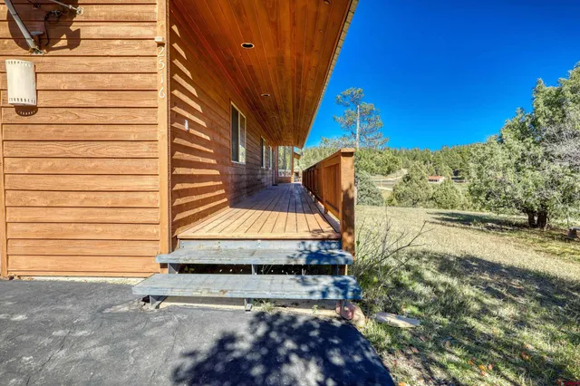 a view of a back yard of the house