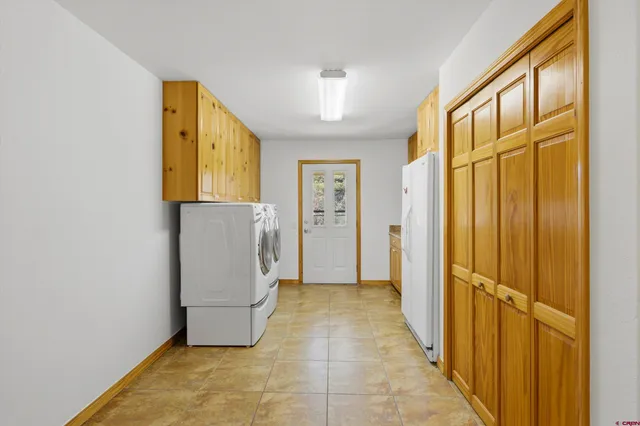 a view of a storage & utility room with a window