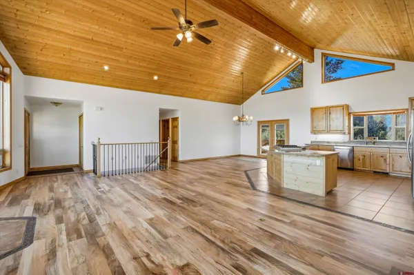 an empty room with a fireplace and cabinet