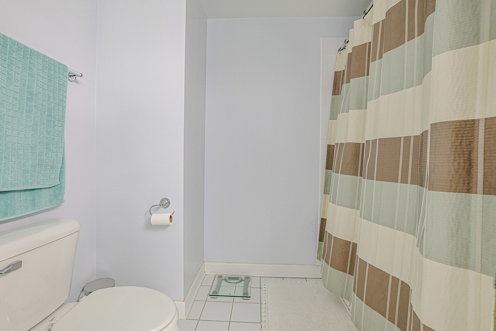 8300 Callie Avenue, Unit 311 Morton Grove, IL 60053 - Photo 15 of 21 a bathroom with a toilet and a shower