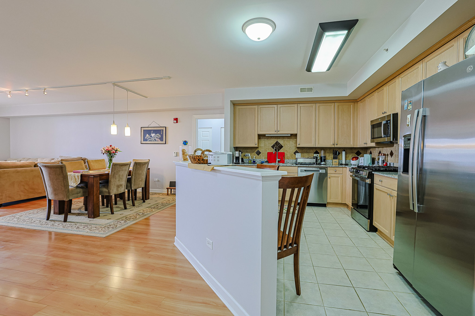 8300 Callie Avenue, Unit 311 Morton Grove, IL 60053 - Photo 7 of 21 a kitchen with lots of counter top space and appliances