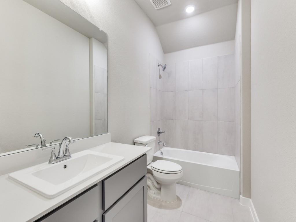15224 Supreme Street Aledo, TX 76008 - Photo 21 of 25 a bathroom with a sink a toilet and shower