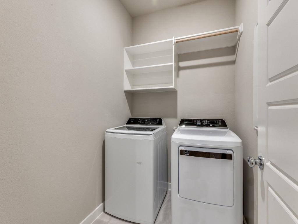 15224 Supreme Street Aledo, TX 76008 - Photo 22 of 25 a view of storage and utility room with washer and dryer