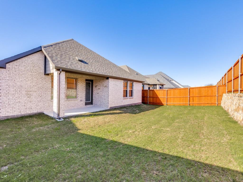 15224 Supreme Street Aledo, TX 76008 - Photo 23 of 25 a backyard of a house with table and chairs