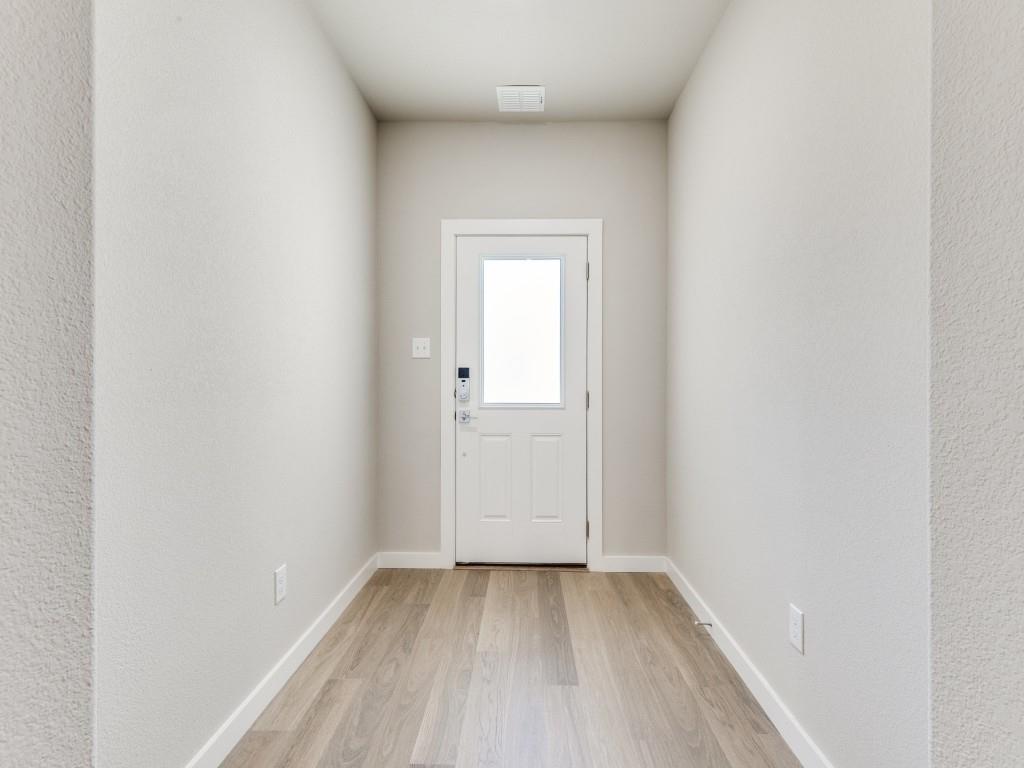 15224 Supreme Street Aledo, TX 76008 - Photo 4 of 25 a view of a small space with wooden floor and a window