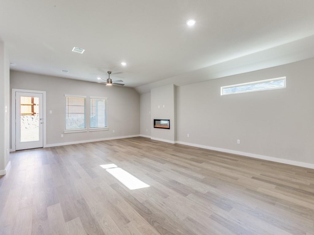 15224 Supreme Street Aledo, TX 76008 - Photo 5 of 25 a view of empty room with wooden floor and fan