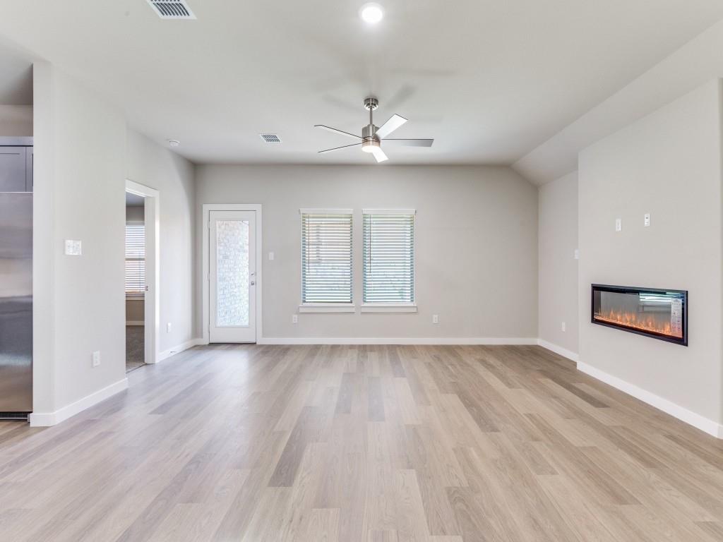 15224 Supreme Street Aledo, TX 76008 - Photo 6 of 25 wooden floor in an empty room with a window