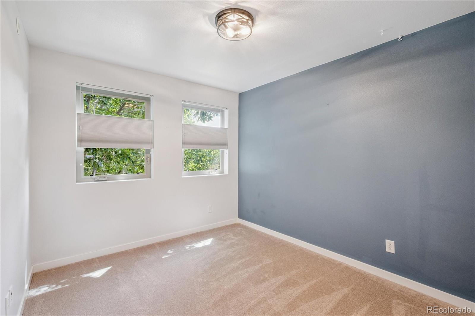 2157 South Logan Street Denver, CO 80210 - Photo 15 of 33 an empty room with windows
