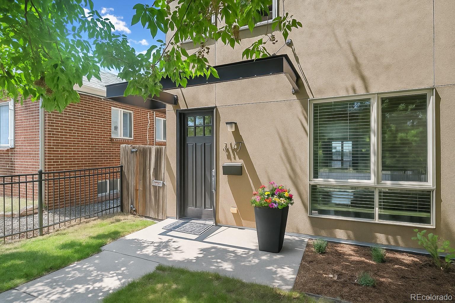 2157 South Logan Street Denver, CO 80210 - Photo 2 of 33 a view of a house with a porch