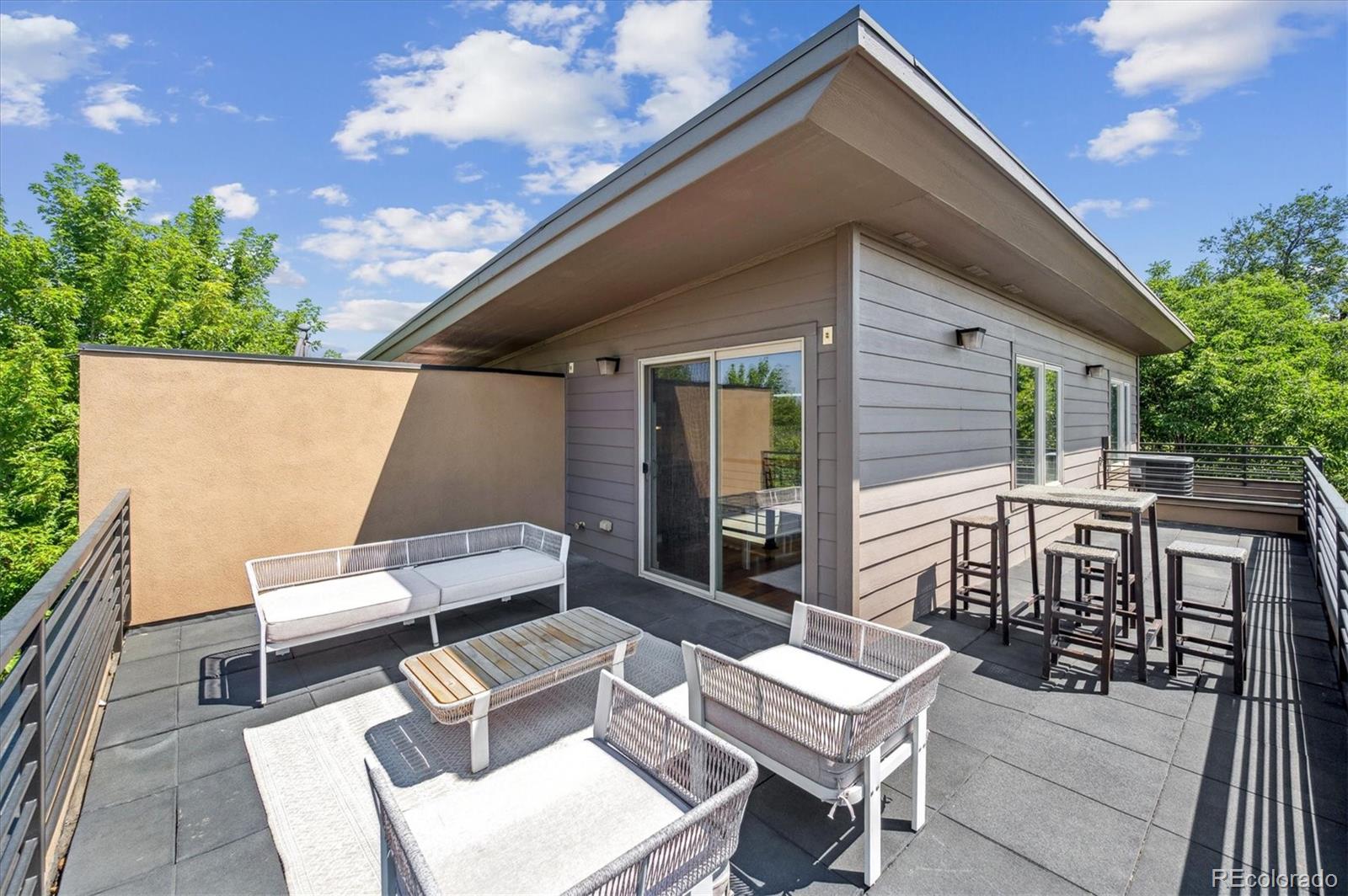 2157 South Logan Street Denver, CO 80210 - Photo 21 of 33 a patio with table and chairs