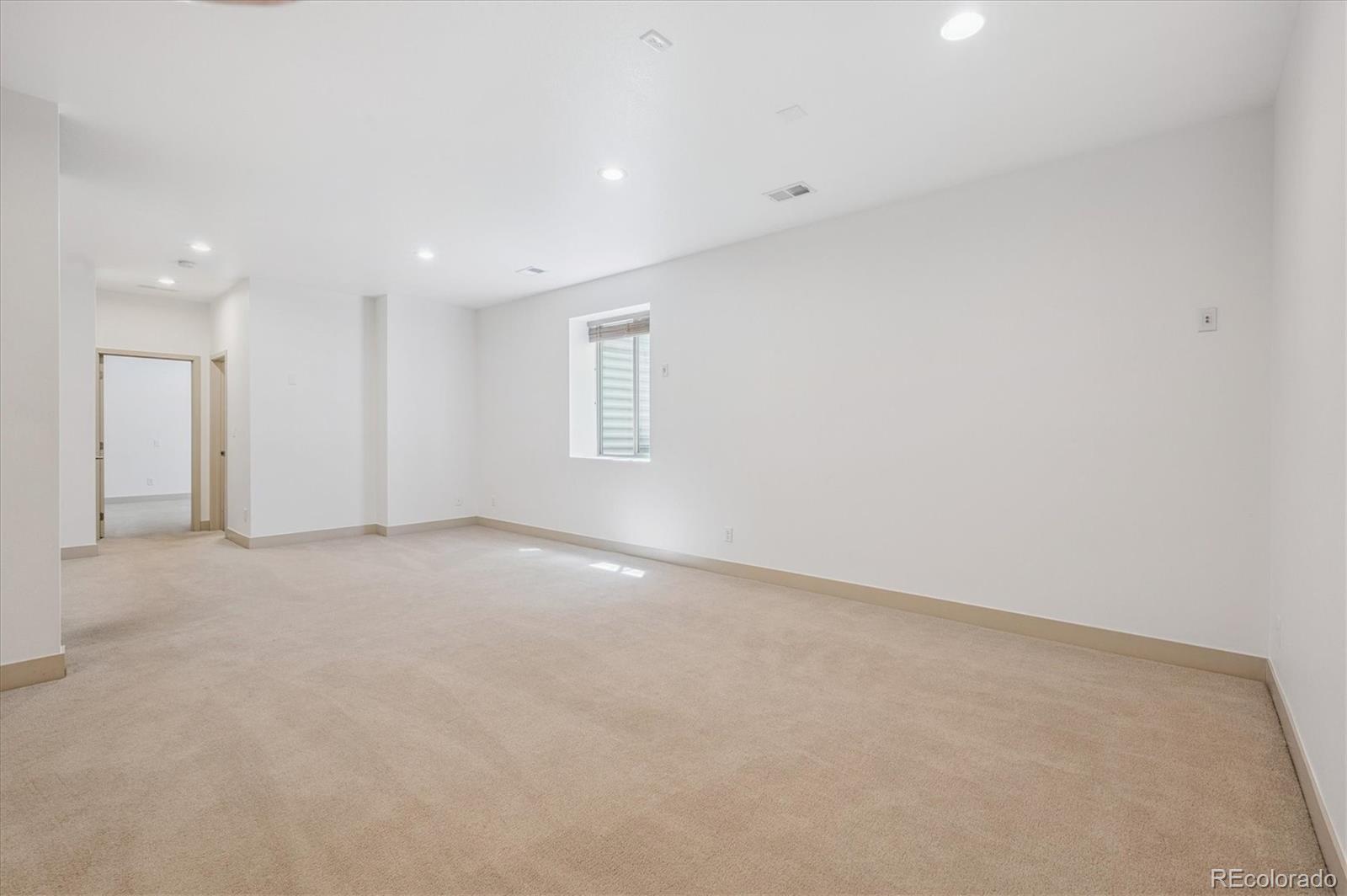 2157 South Logan Street Denver, CO 80210 - Photo 23 of 33 a view of an empty room with a window