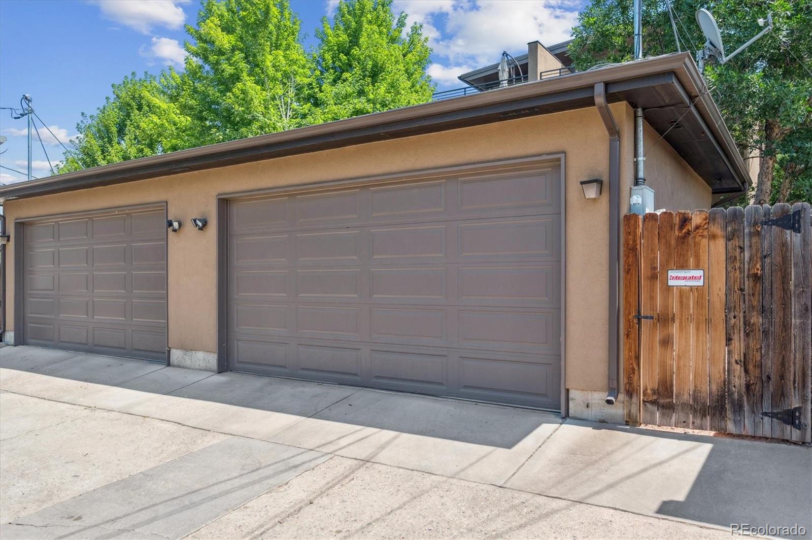 2157 South Logan Street Denver, CO 80210 - Photo 27 of 33 a side view of a house with garage