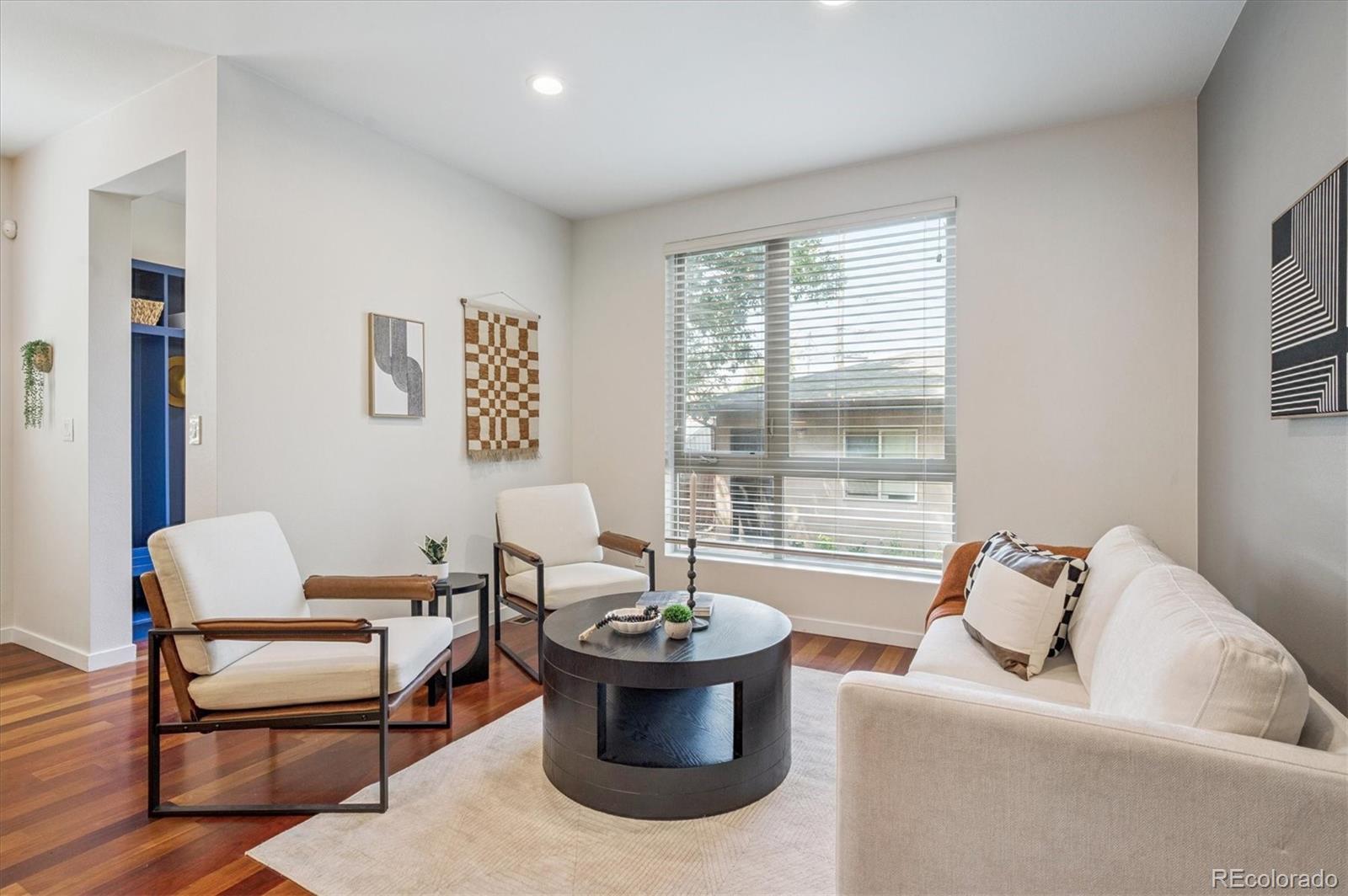 2157 South Logan Street Denver, CO 80210 - Photo 9 of 33 a living room with furniture and a potted plant