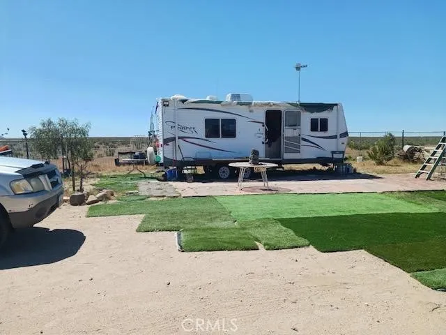 a view of a back yard of the house