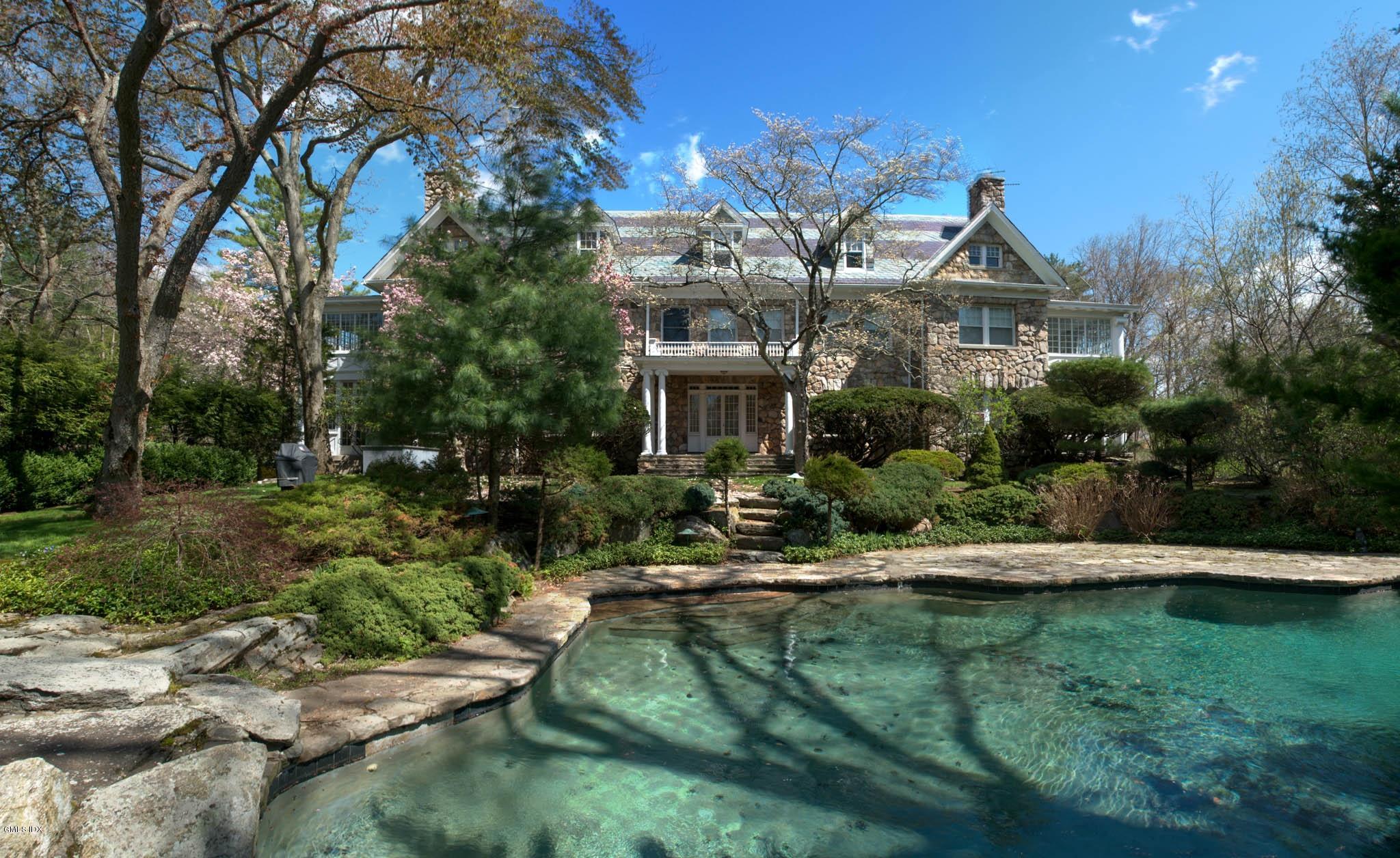 105 Dingletown Road Greenwich, CT 06830 - Photo 13 of 65 a front view of a house with a yard
