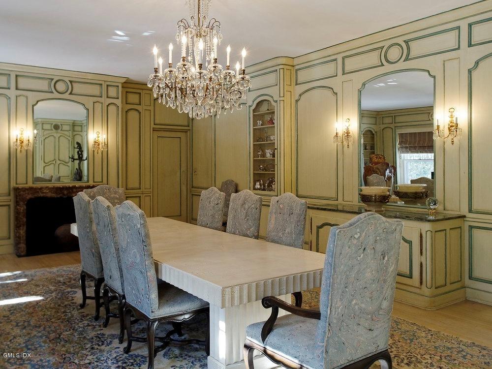 105 Dingletown Road Greenwich, CT 06830 - Photo 15 of 65 a view of a dining room with furniture and chandelier