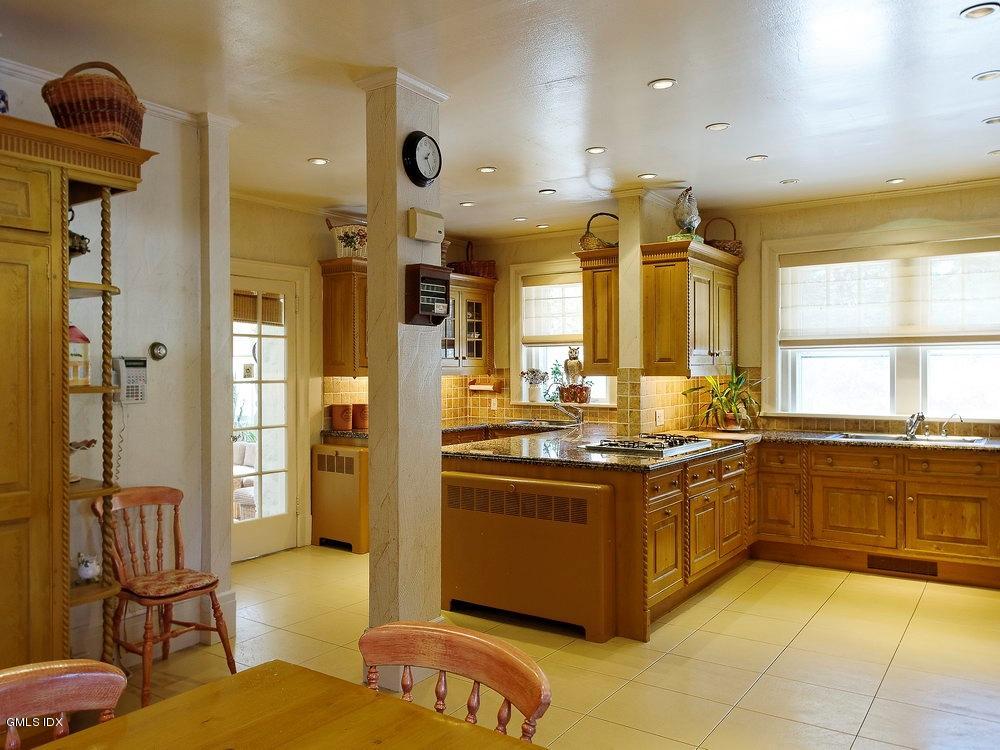 105 Dingletown Road Greenwich, CT 06830 - Photo 16 of 65 a large kitchen with stainless steel appliances granite countertop a stove and a refrigerator