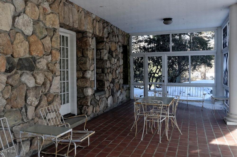 105 Dingletown Road Greenwich, CT 06830 - Photo 21 of 65 a view of a dining room with furniture wooden floor and chandelier