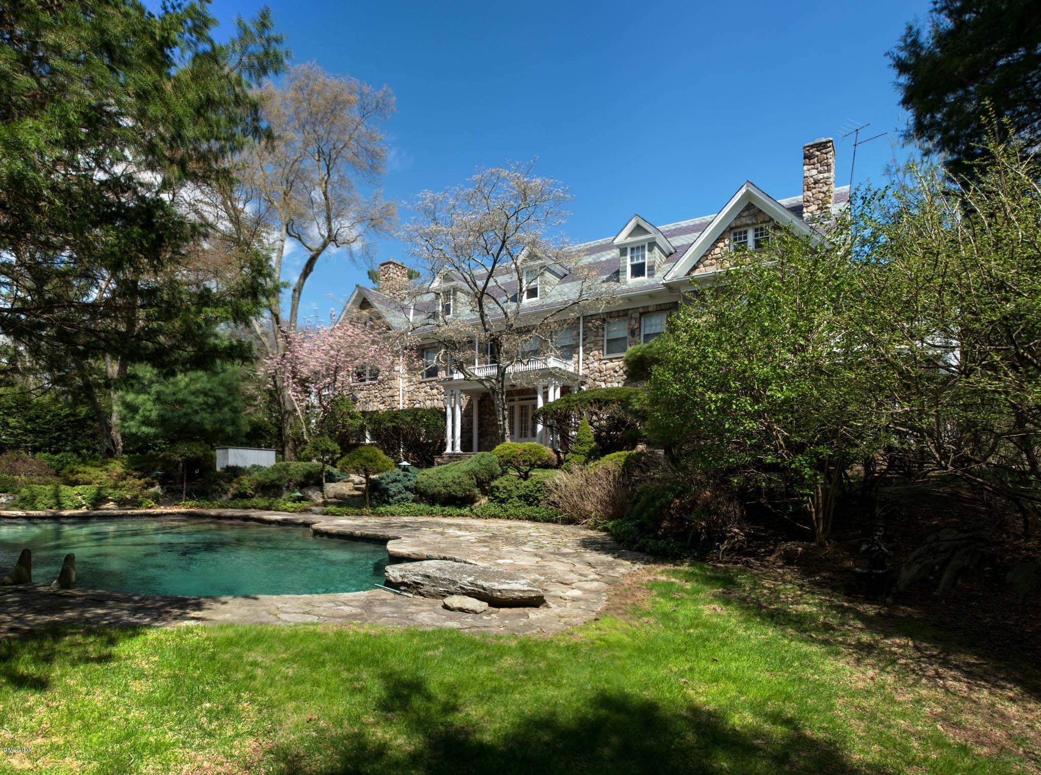 105 Dingletown Road Greenwich, CT 06830 - Photo 24 of 65 a view of a lake with a building in the background