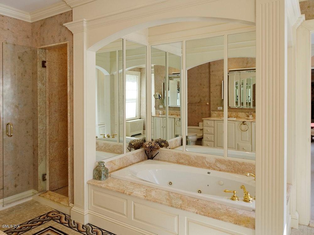 105 Dingletown Road Greenwich, CT 06830 - Photo 25 of 65 a bathroom with a bathtub and a shower