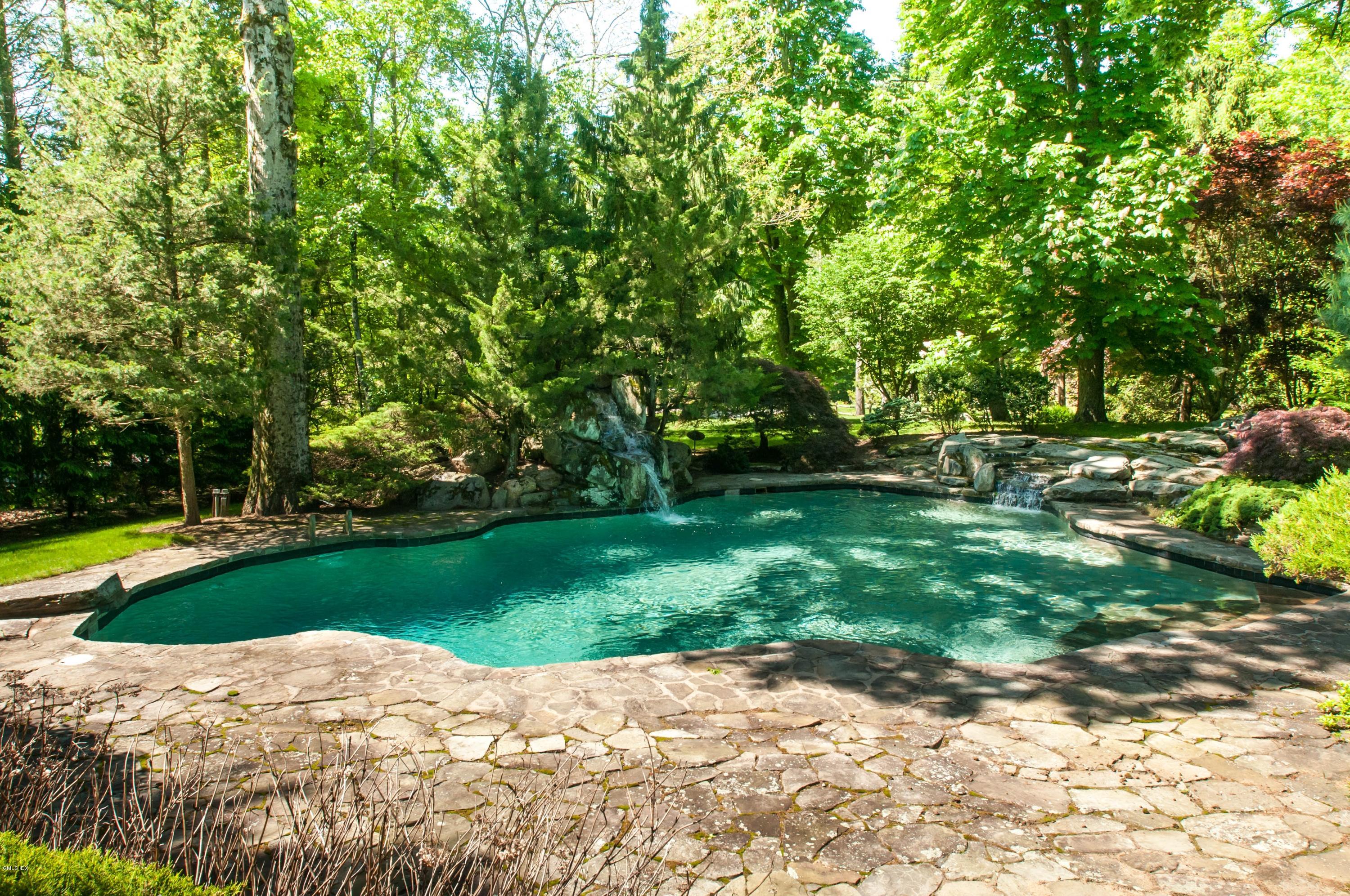 105 Dingletown Road Greenwich, CT 06830 - Photo 51 of 65 a view of backyard with swimming pool and green space