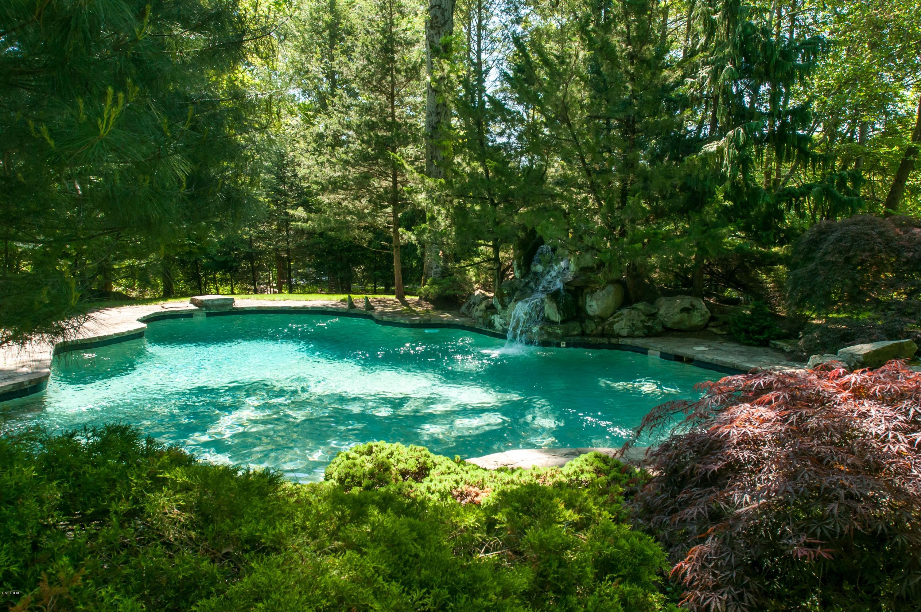 105 Dingletown Road Greenwich, CT 06830 - Photo 6 of 65 a view of a green field with lots of bushes