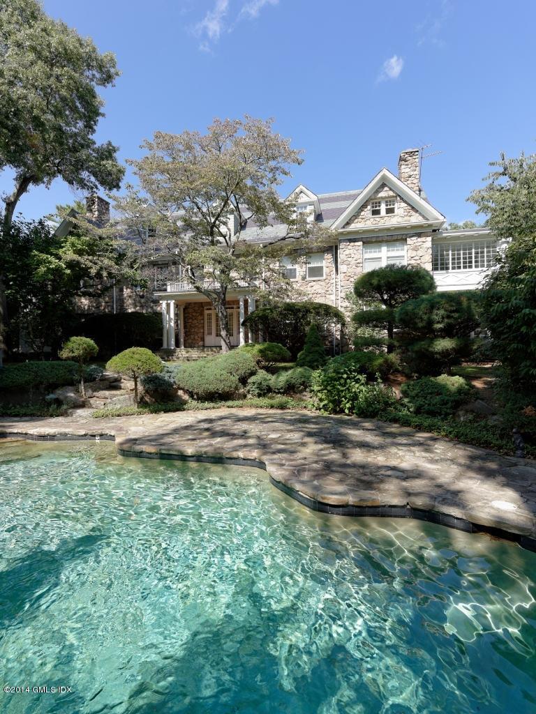105 Dingletown Road Greenwich, CT 06830 - Photo 61 of 65 a front view of house with yard and green space