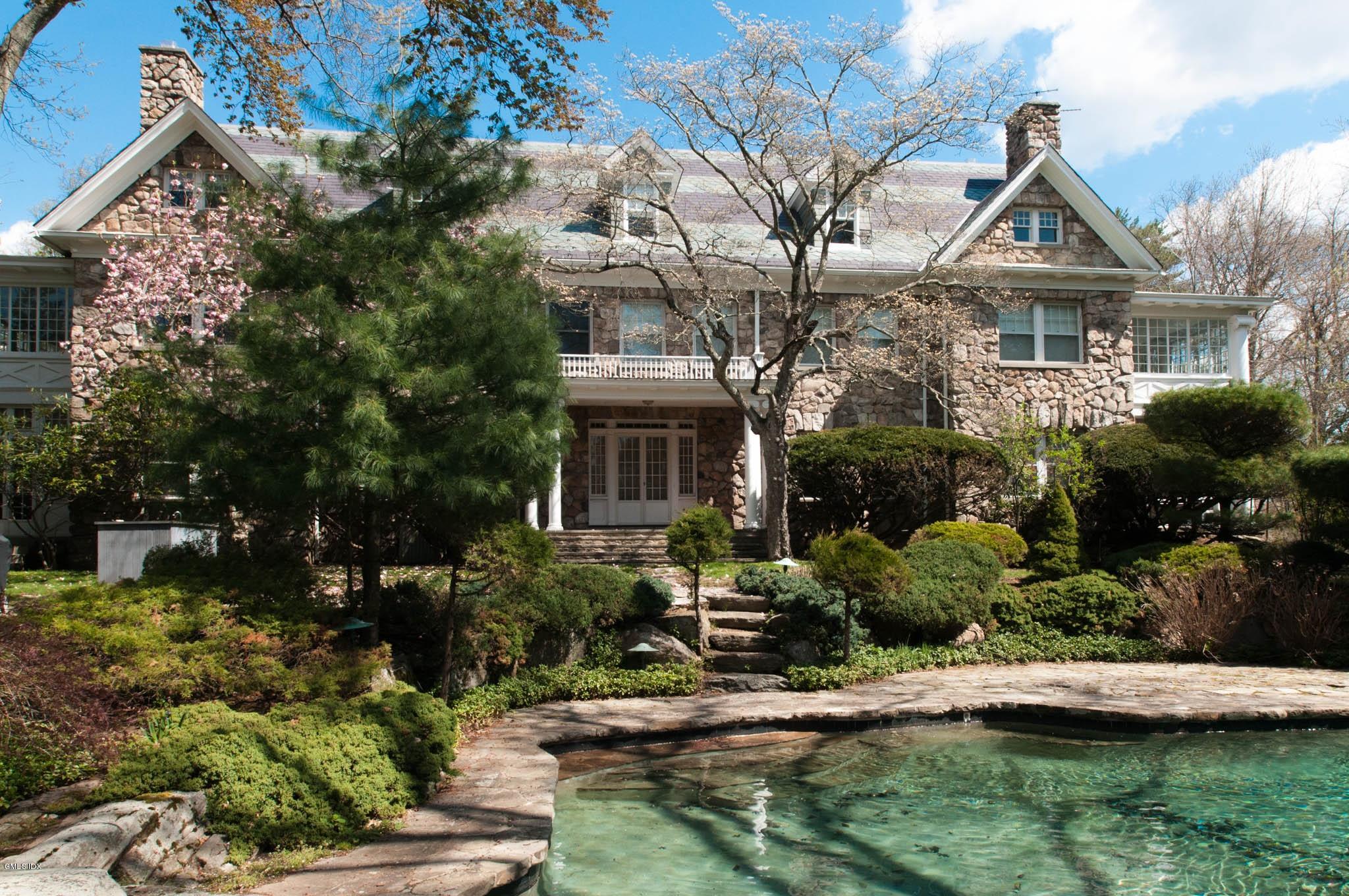 105 Dingletown Road Greenwich, CT 06830 - Photo 7 of 65 a front view of a house with a yard
