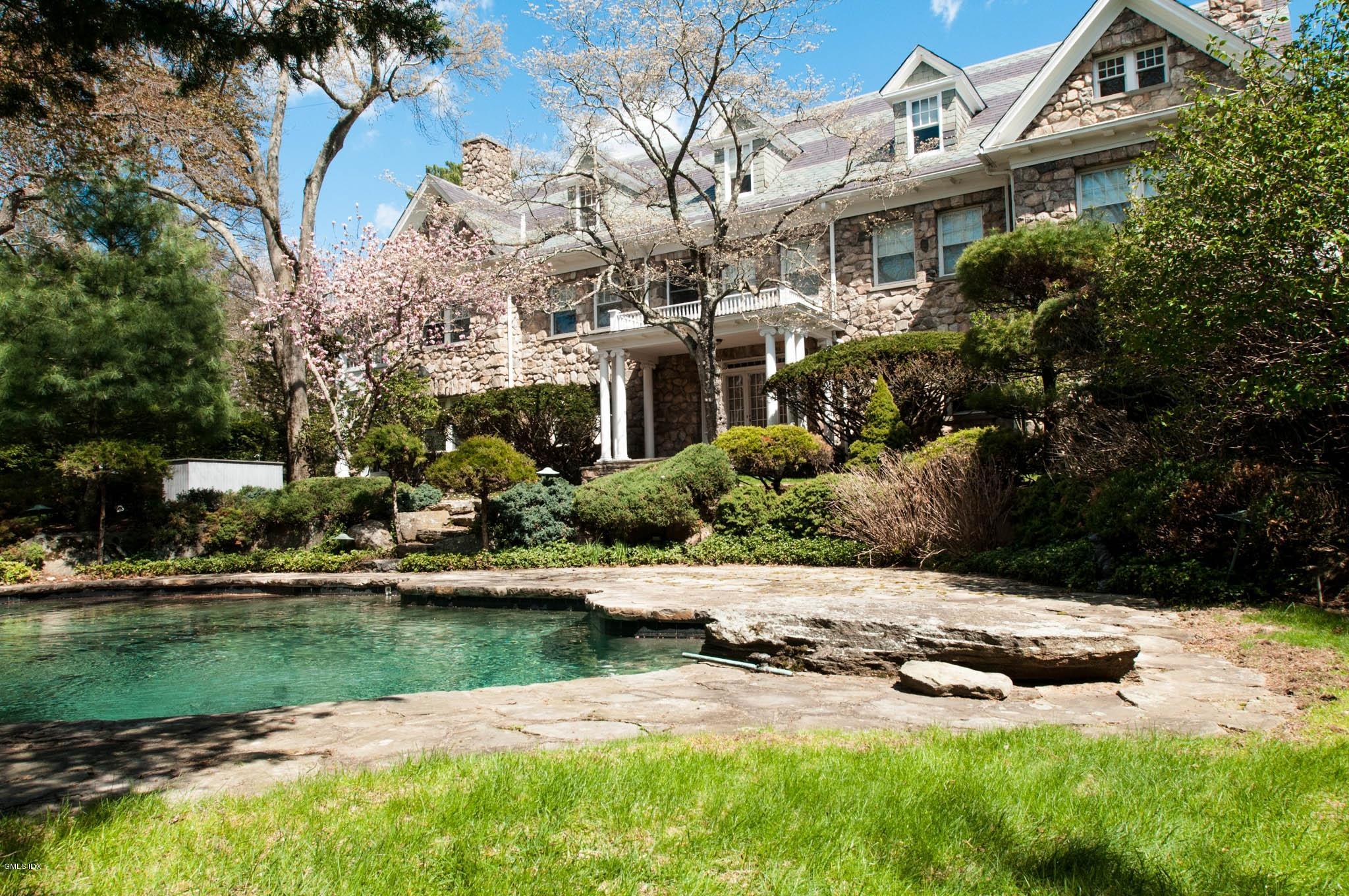 105 Dingletown Road Greenwich, CT 06830 - Photo 8 of 65 a view of house with swimming pool and yard with green space