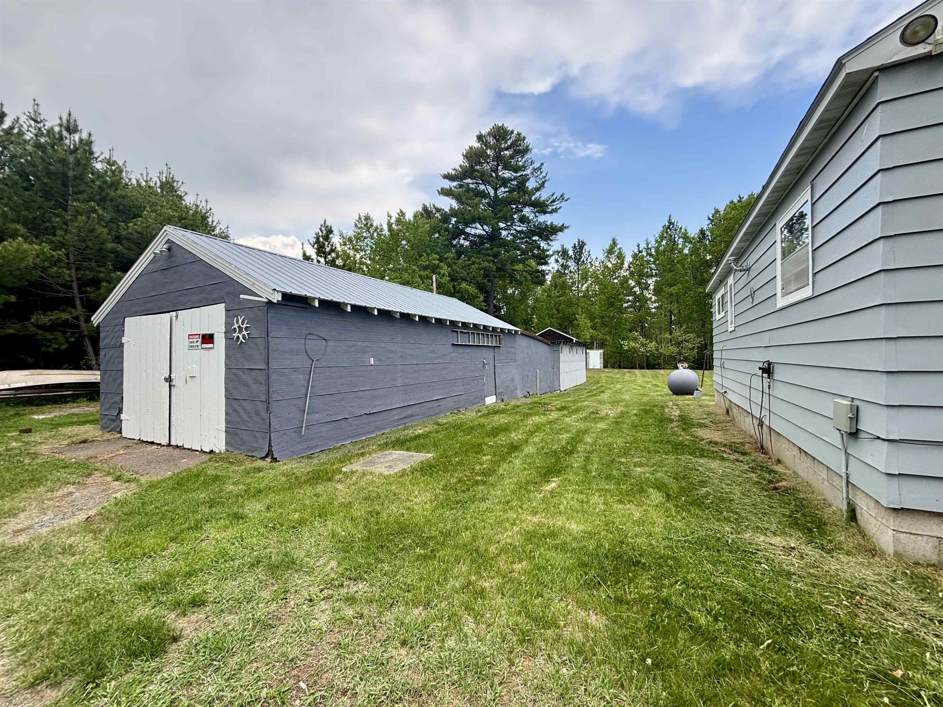 9724 State Highway 1 Isabella, MN 55607 - Photo 3 of 21 View of grassy yard with an outbuilding