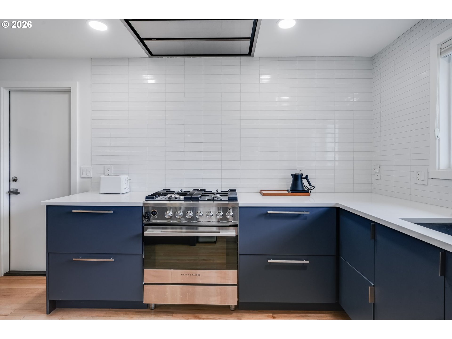 5214 Northeast Jessup Street Portland, OR 97218 - Photo 12 of 28 a kitchen with a stove and a sink