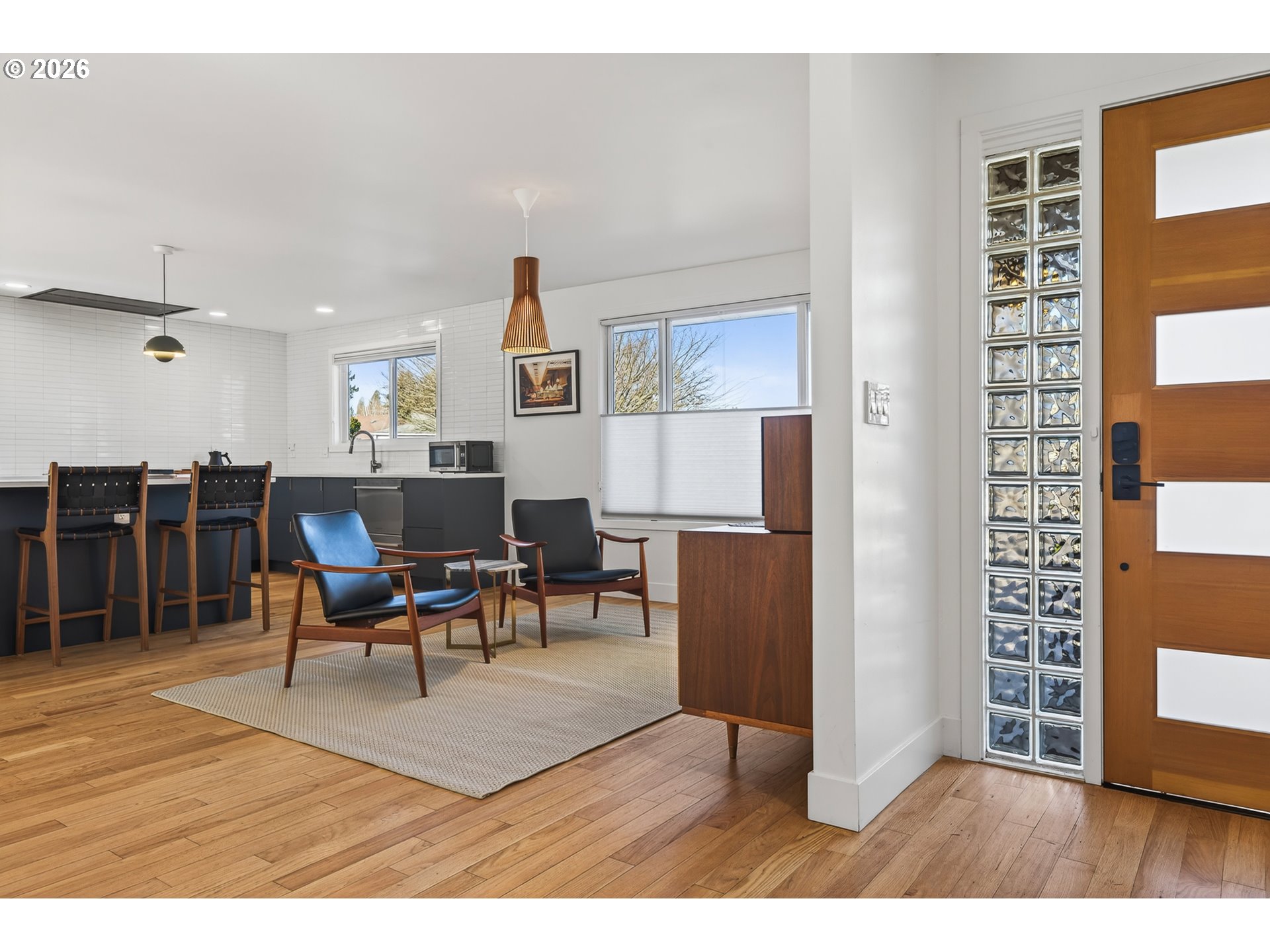 5214 Northeast Jessup Street Portland, OR 97218 - Photo 35 of 36 a living room with furniture a dining table and wooden floor