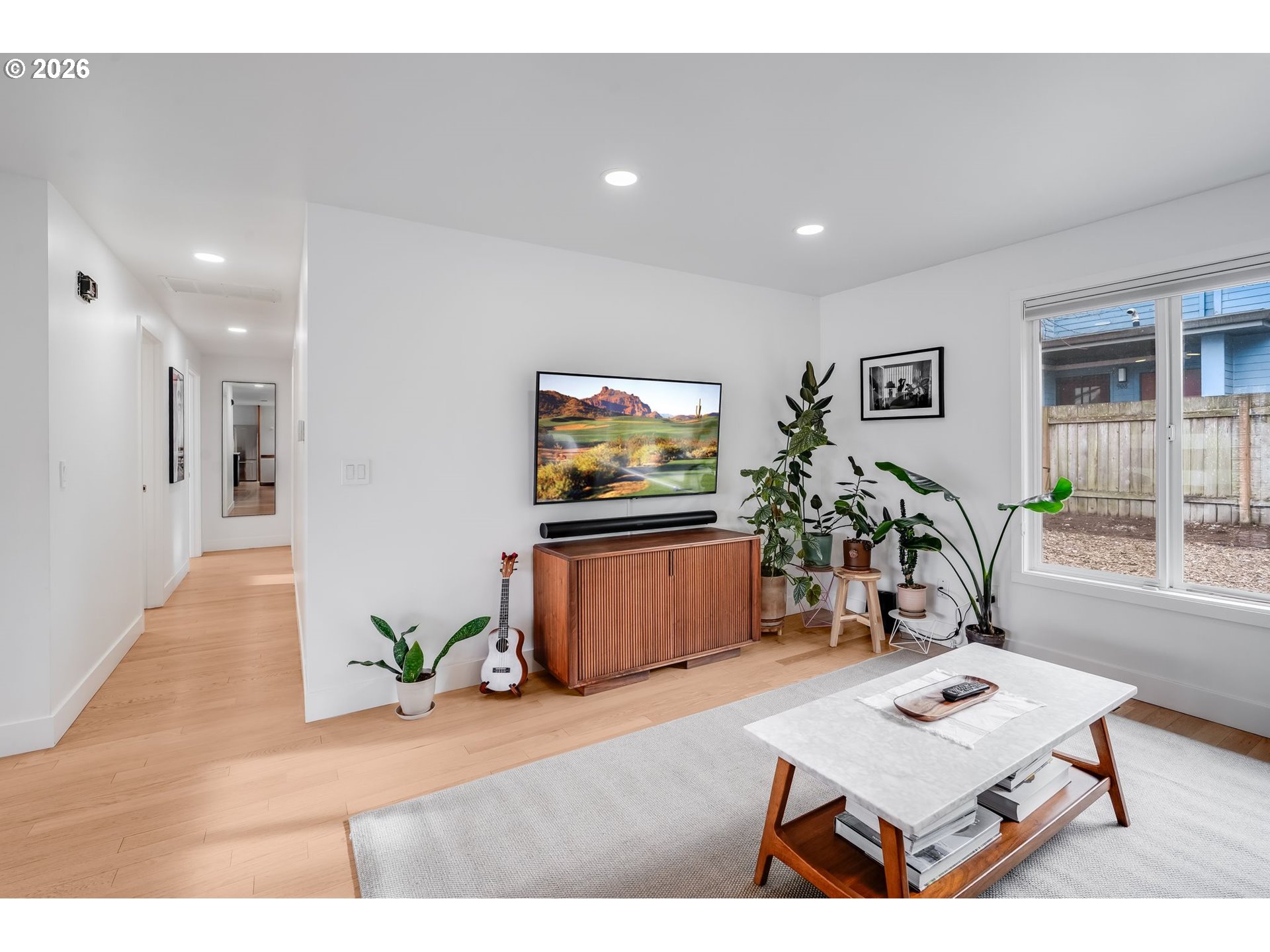 5214 Northeast Jessup Street Portland, OR 97218 - Photo 5 of 28 a living room with furniture and a flat screen tv