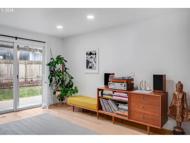 a room with furniture and a potted plant