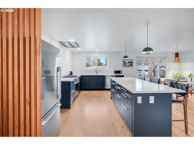 a kitchen with sink cabinets and stove