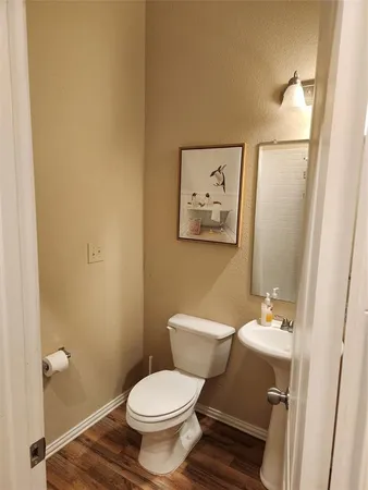 a bathroom with a toilet and a sink
