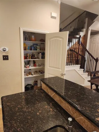 a view of a living room and stairs