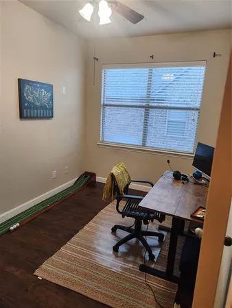 a workspace with furniture and window