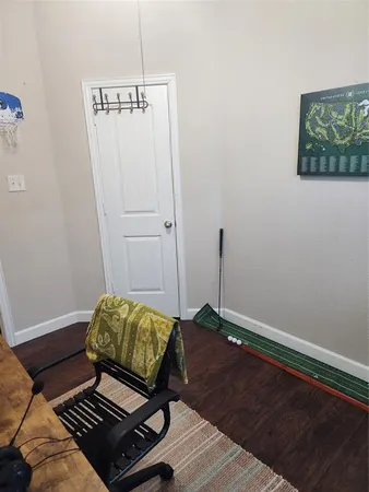 a living room with a bed and a window