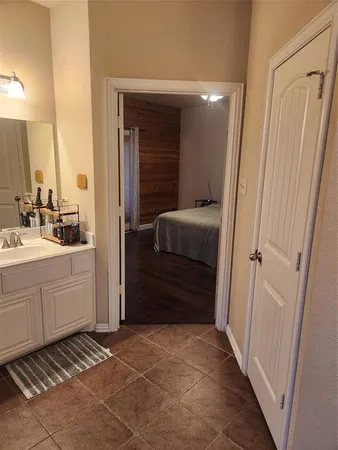 a bathroom with a sink a mirror and a shower