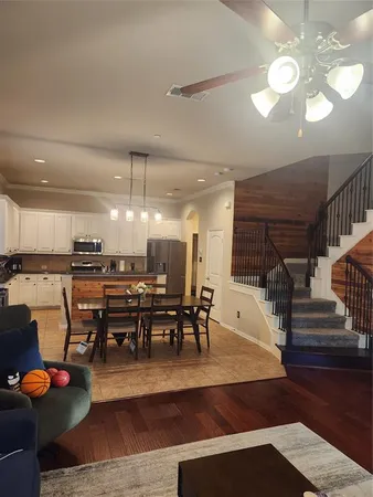 a view of a dining room with furniture and wooden floor