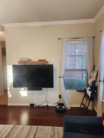 a living room with a couch and a flat screen tv