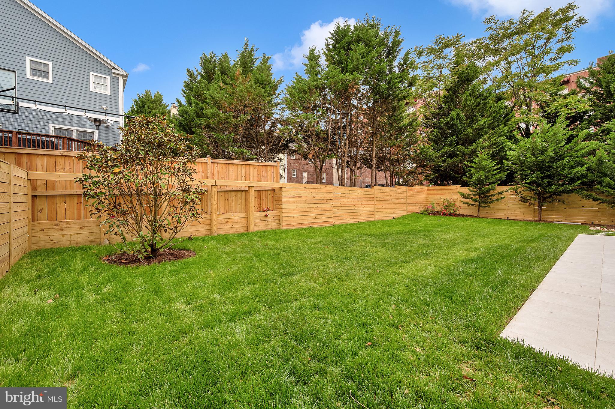4708 Rosedale Avenue Bethesda, MD 20814 - Photo 69 of 69 Lush green oasis with wooden fencing.
